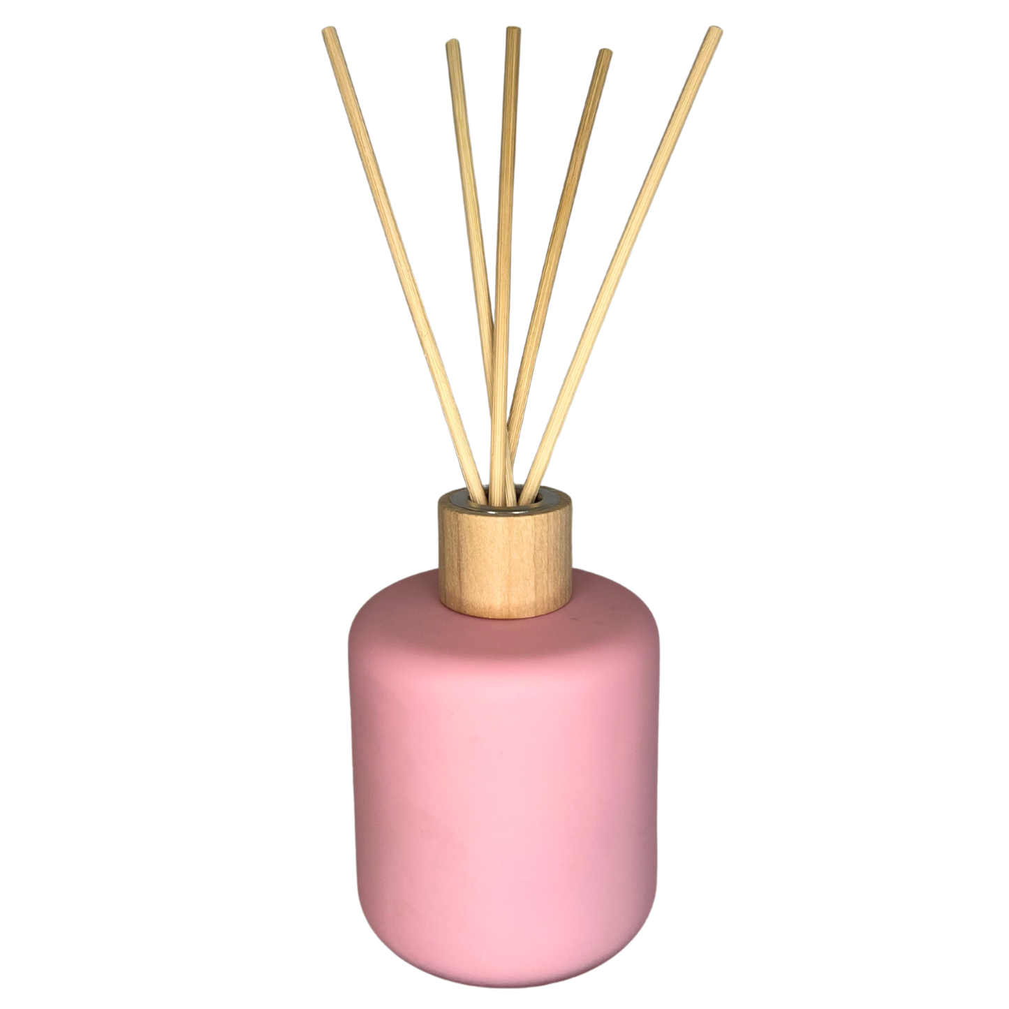 baby pink coloured reed diffuser with 5 reeds placed inside