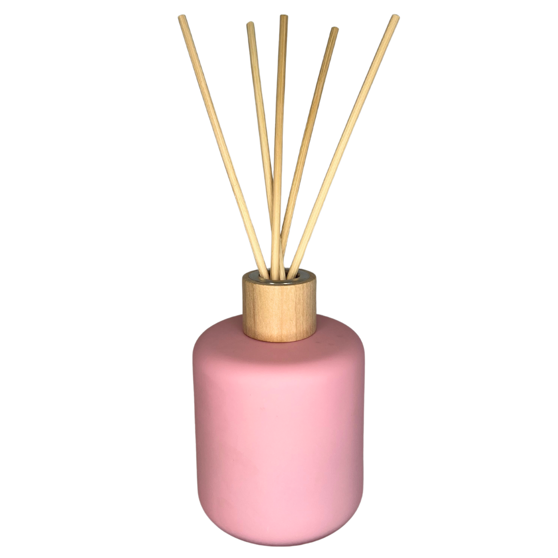 baby pink coloured reed diffuser with 5 reeds placed inside