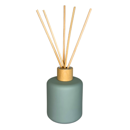 blue diffuser jar with reeds inside and timber lid