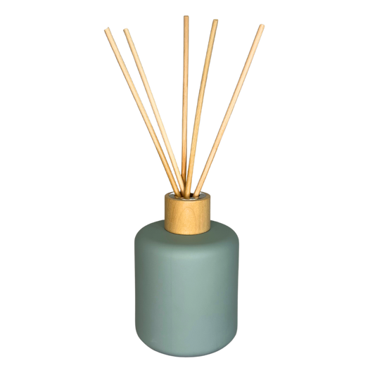 blue diffuser jar with reeds inside and timber lid